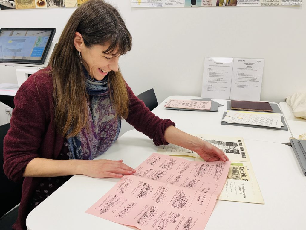 Lizzie Pridmore, Cataloguing Archivist at FX Plus, with one of her favourite finds from the Royston Green collection, an introduction to the Cornish language, Kernewek, looking at the meaning of different place names.