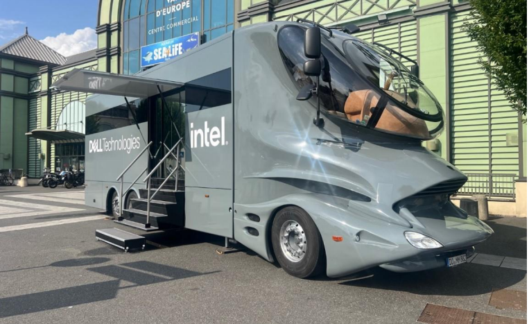 Image of a large, futuristic looking grey tour bus with Alienware Intel written on it.